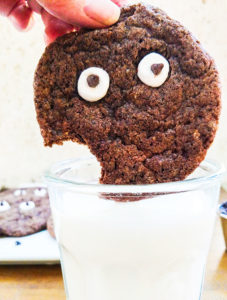 Googly eyes cookies dunking in milk