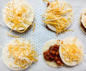 bite size chicken tacos ready for the oven