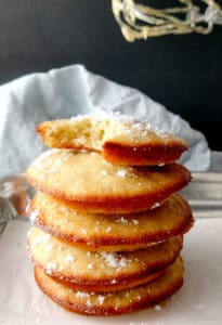 bnanan muffin tops stacked with powdered sugar